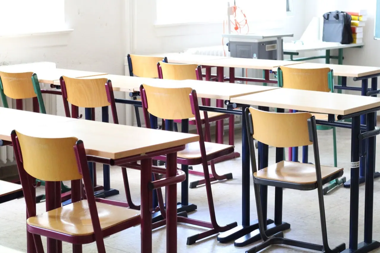 Empty rows of seats in a classroom
