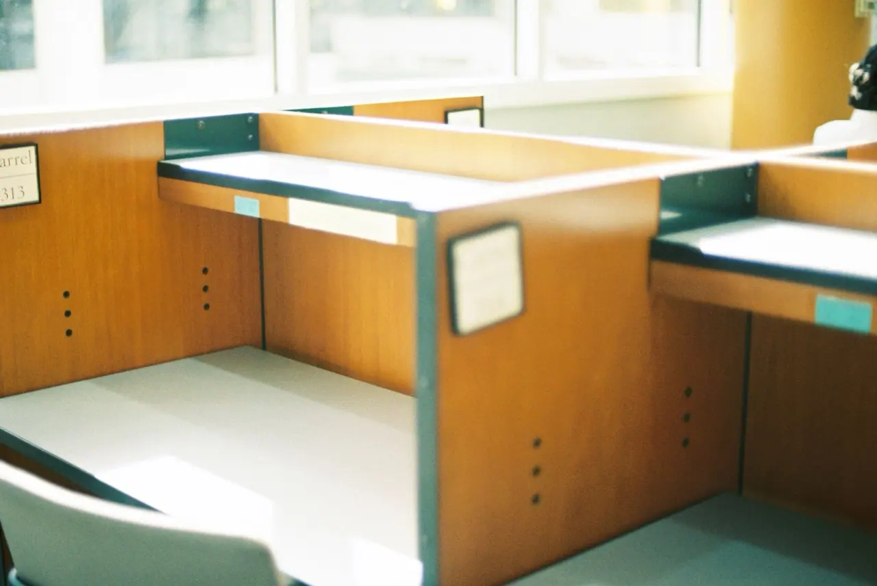 Empty office desk beside a window after a move