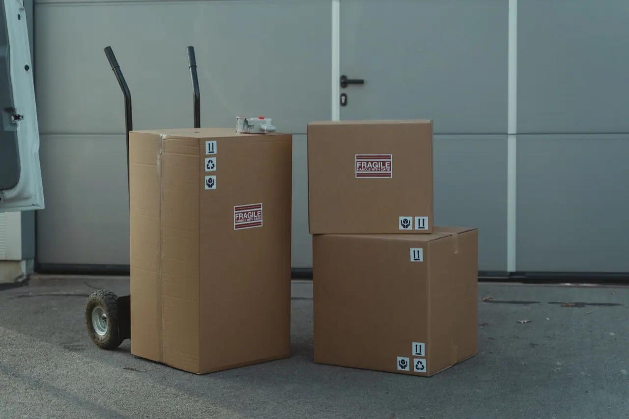 Sealed cardboard boxes stacked on a concrete floor