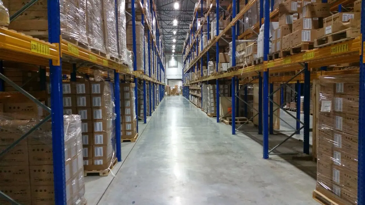 Stacks of cardboard boxes on pallets in a warehouse